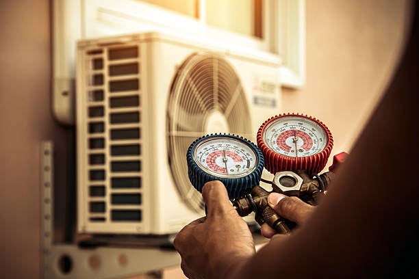 Professional Heat Pump Repair technician working in River Falls, WI